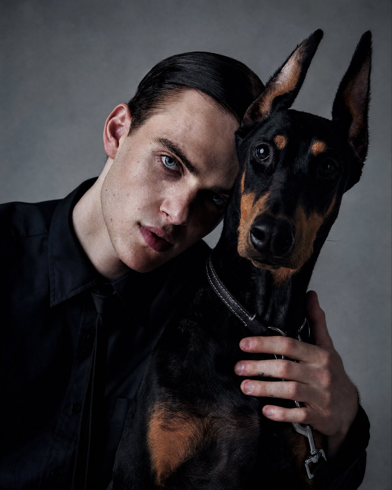Young Man and Doberman