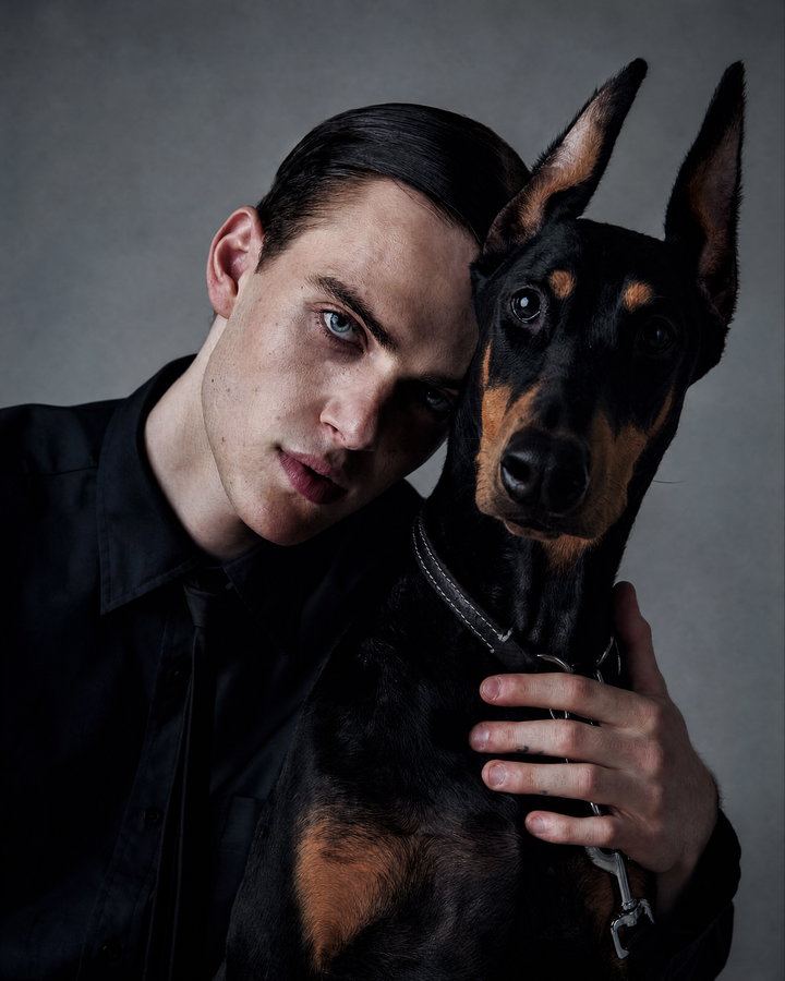 Young Man and Doberman