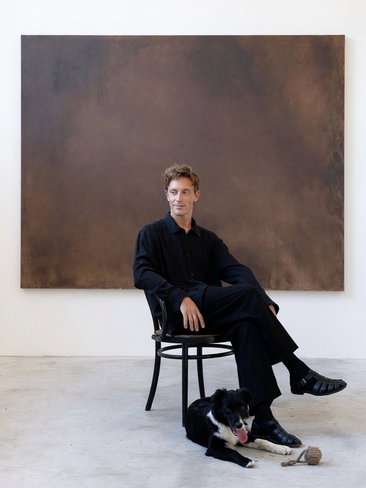 Contemplative Individual in Minimalist Art Gallery