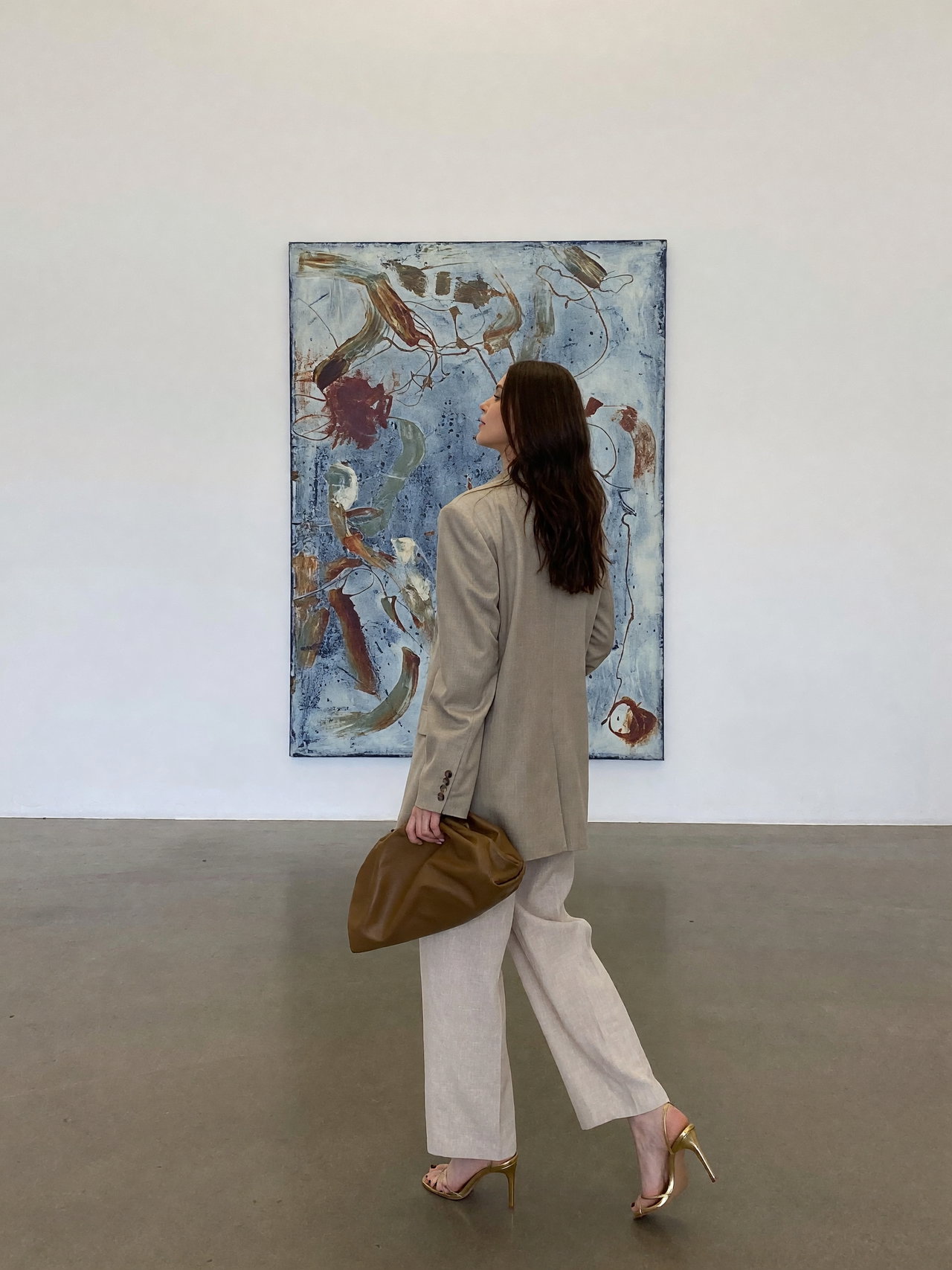 Stylish Visitor in Modern Art Gallery