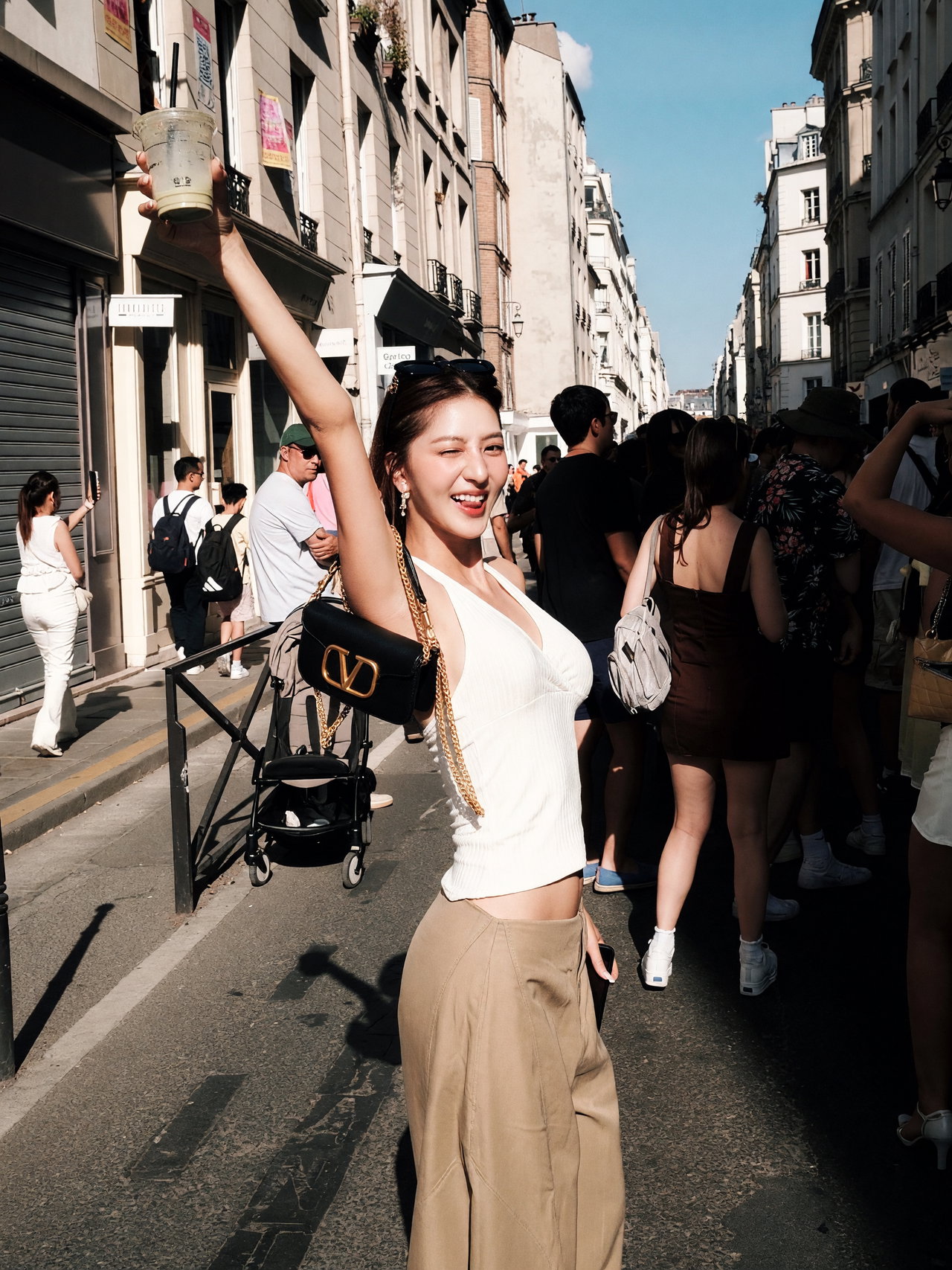 Joyful Young Woman in Bustling Urban Street