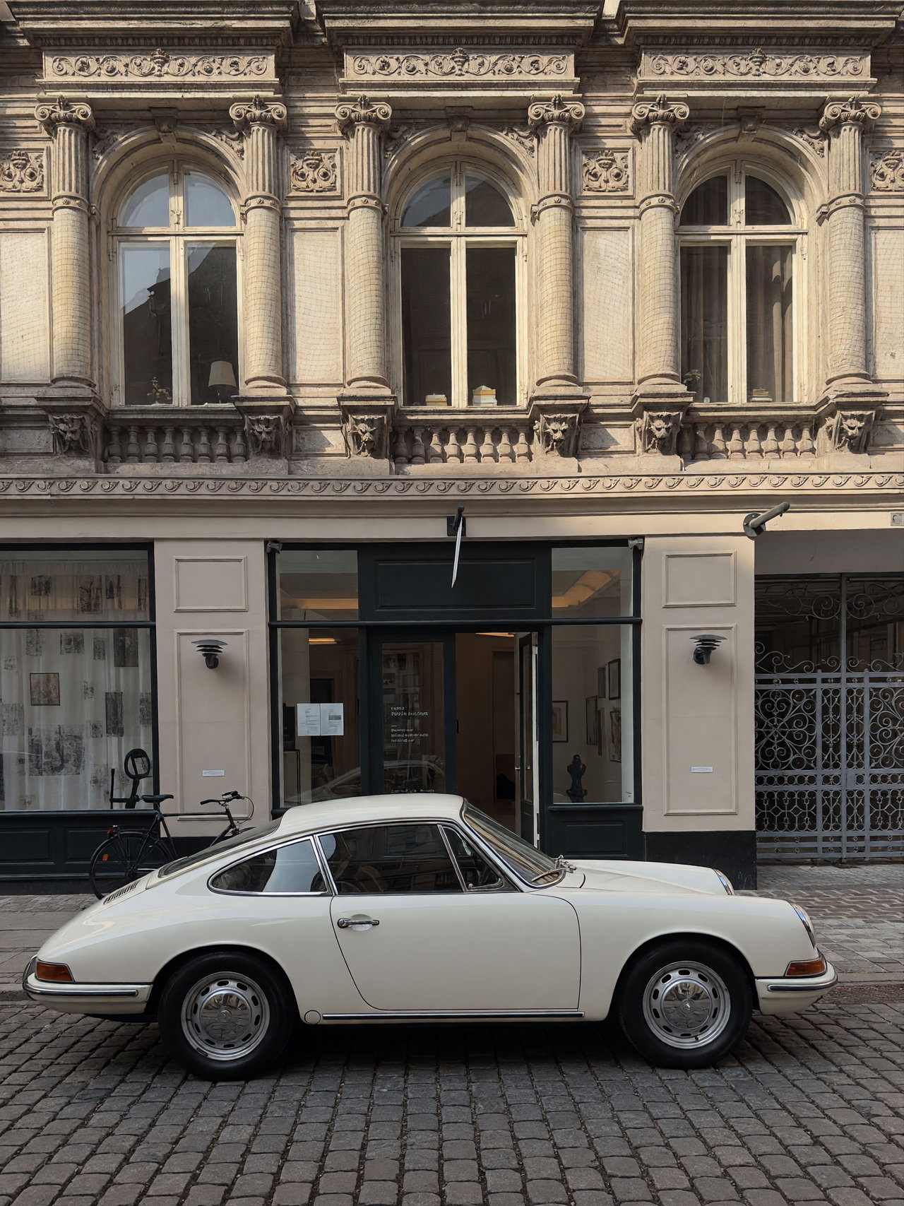 Vintage White Sports Car on Cobblestone Street