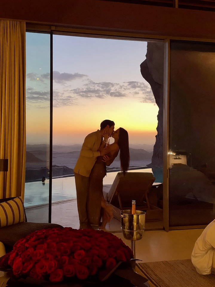 Couple Kissing in Luxurious Sunset Interior