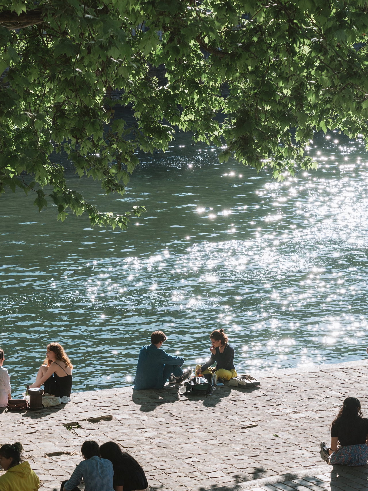 Group of Friends by the Shimmering River
