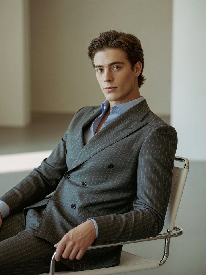 Young Man in Tailored Suit in Minimalist Studio