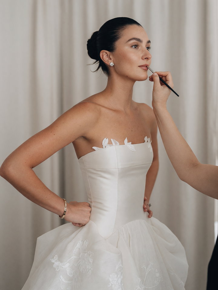 Elegant Young Woman in Strapless Gown