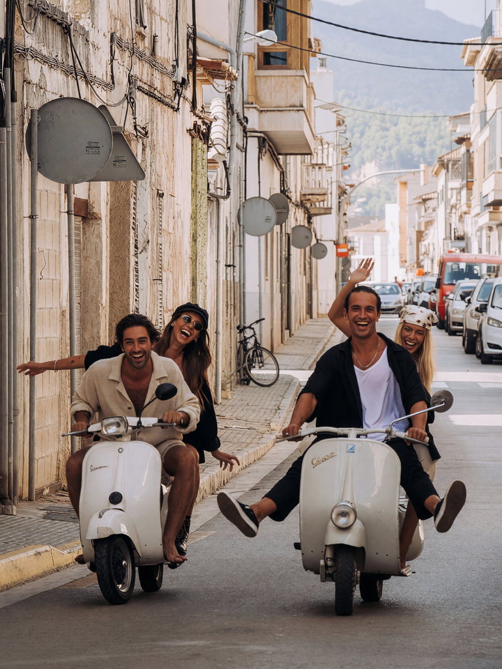 Joyful Street Scene with Friends on Scooters