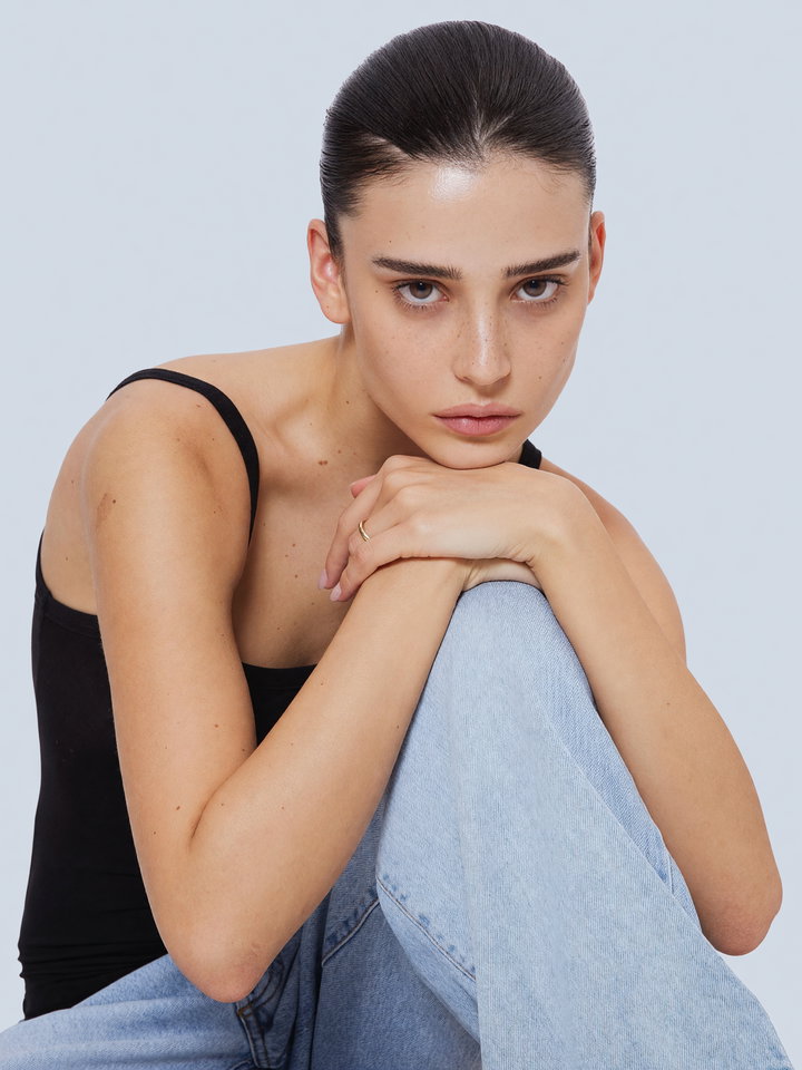 Model in Black Top and Jeans