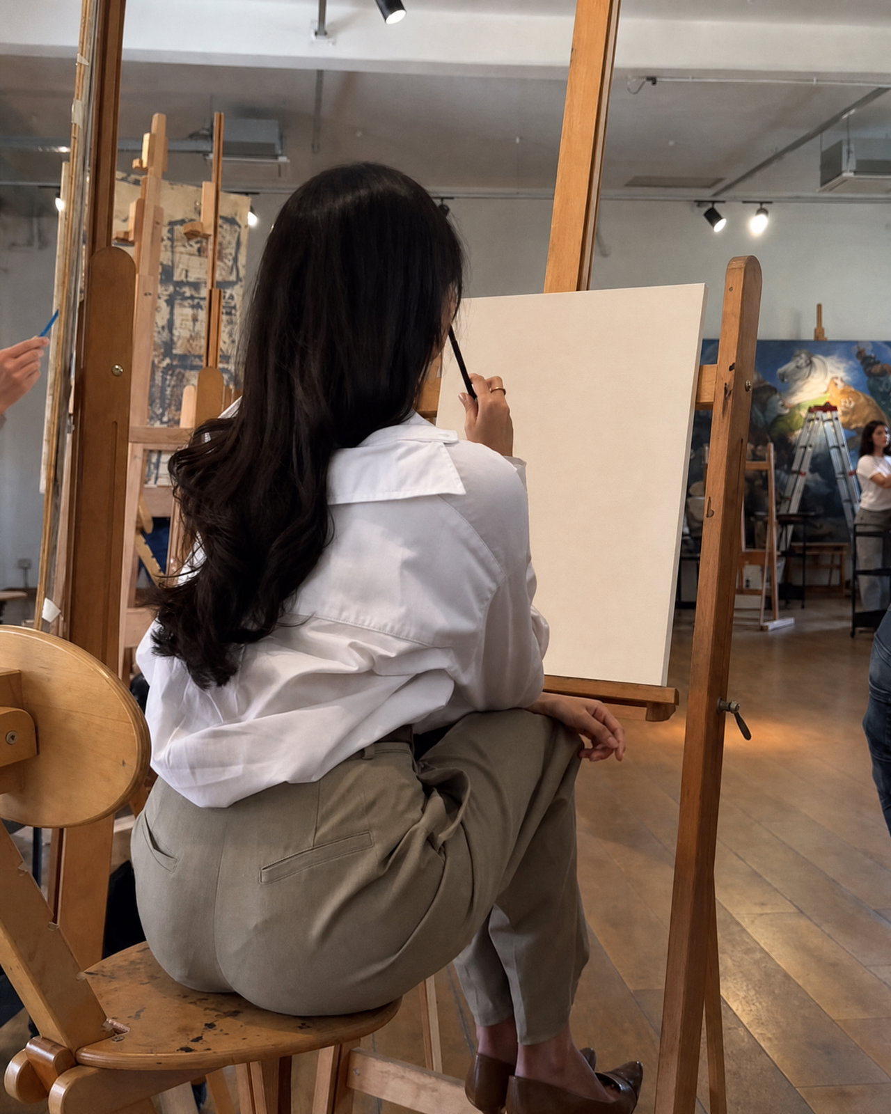 Artist in Studio Preparing to Paint