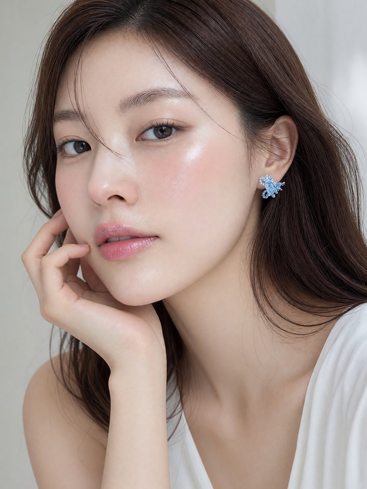 Elegant Portrait of a Woman with Blue Earrings