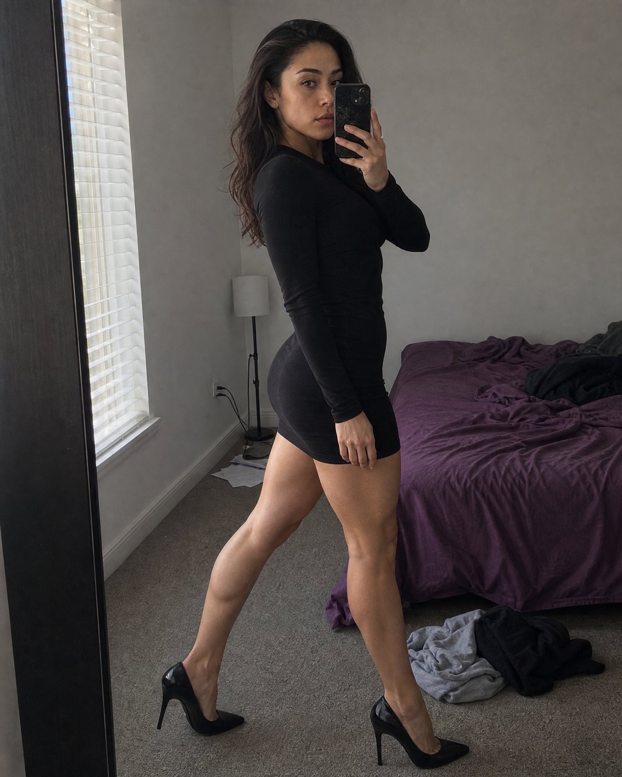 Mirror Selfie of Woman in Black Mini Dress