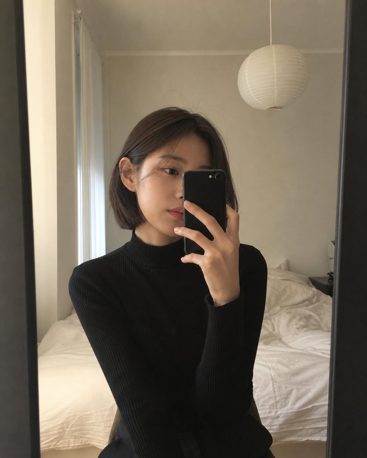 Candid Mirror Selfie of Young Woman in Black