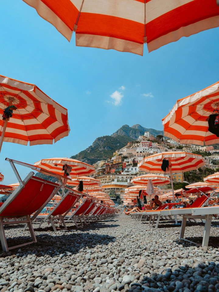 View of Positano Beach with Striped Umbrellas
