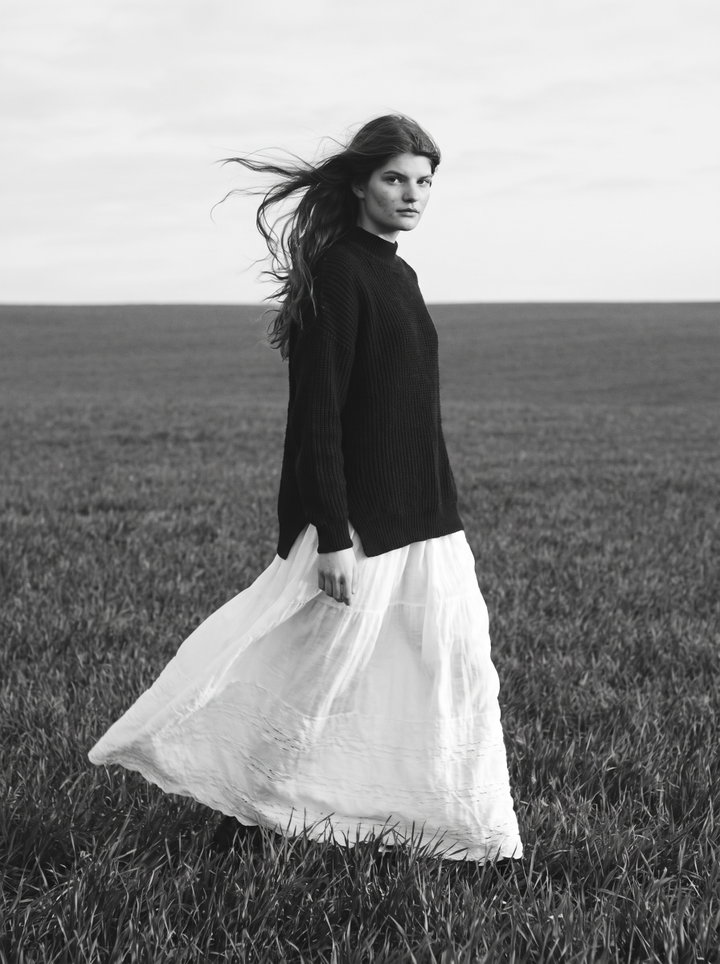 Woman in Windy Field in Black and White