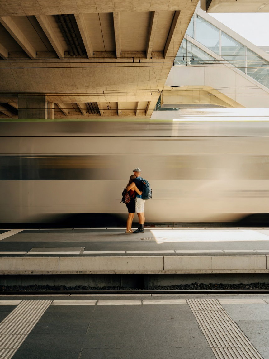 Couple Embracing on Train Platform