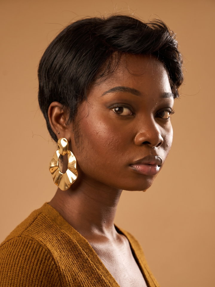 Portrait of Woman with Gold Statement Earrings