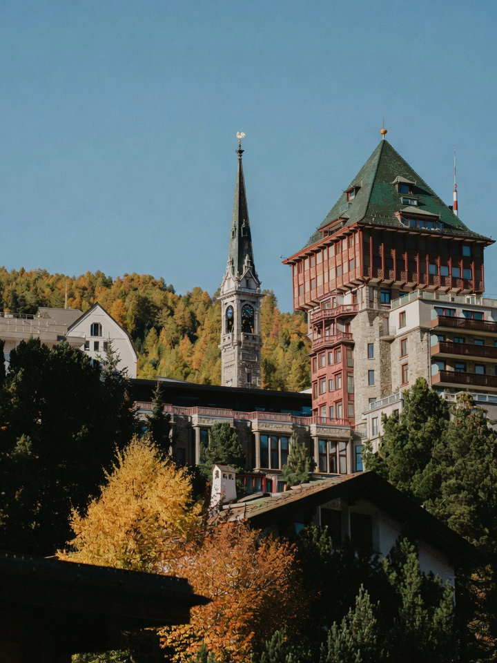 St. Moritz Hotel Tower and Church Spire in Autumn