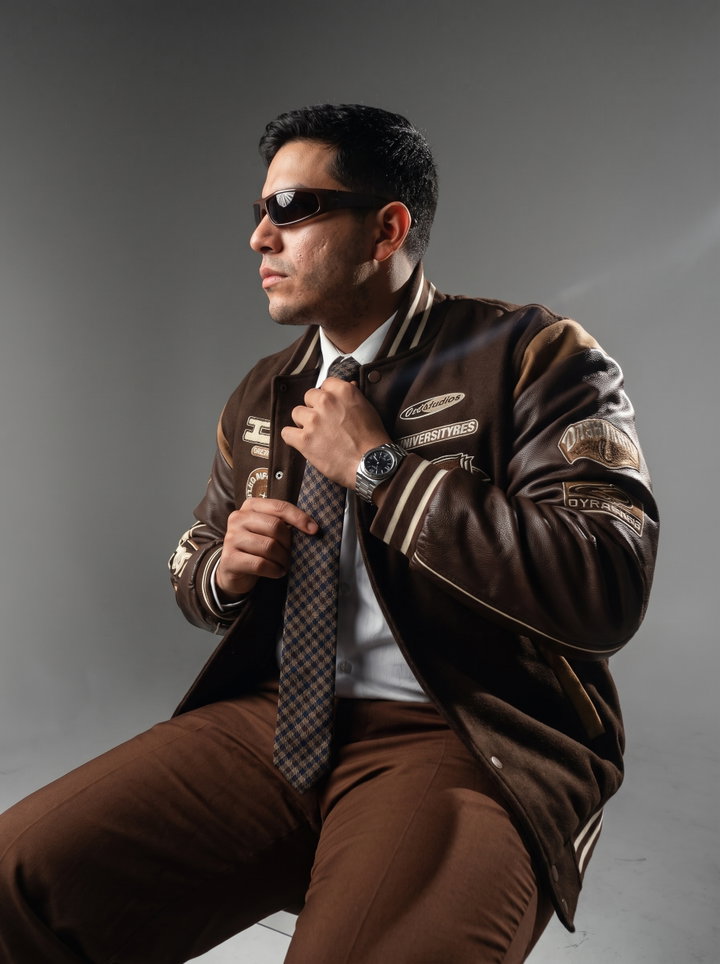 Stylish Man in Brown Varsity Jacket