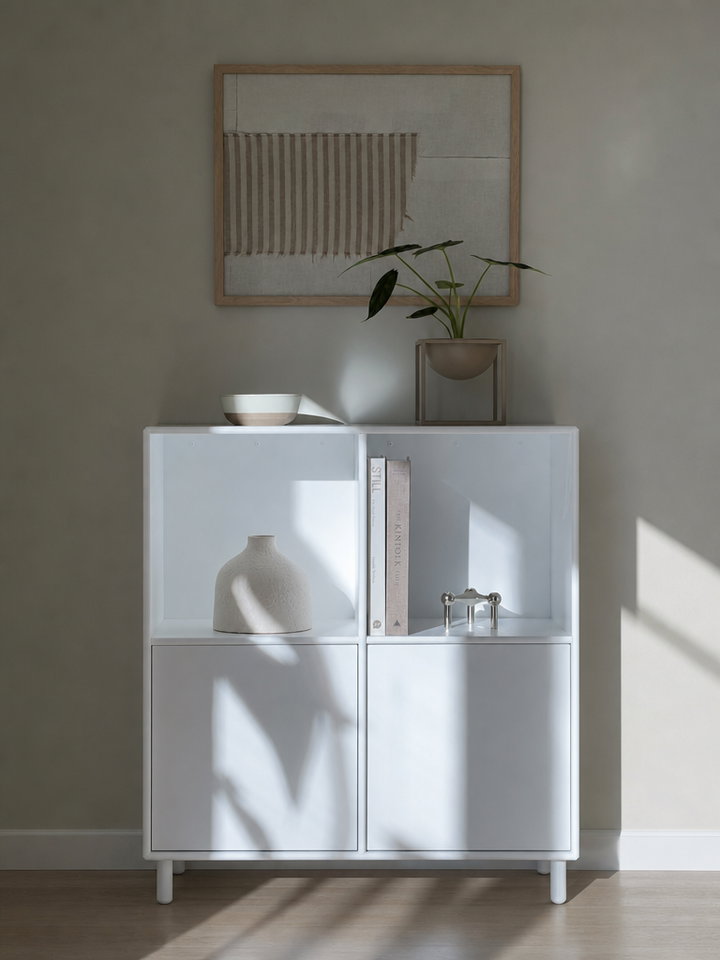 Minimalist White Sideboard with Vase and Books