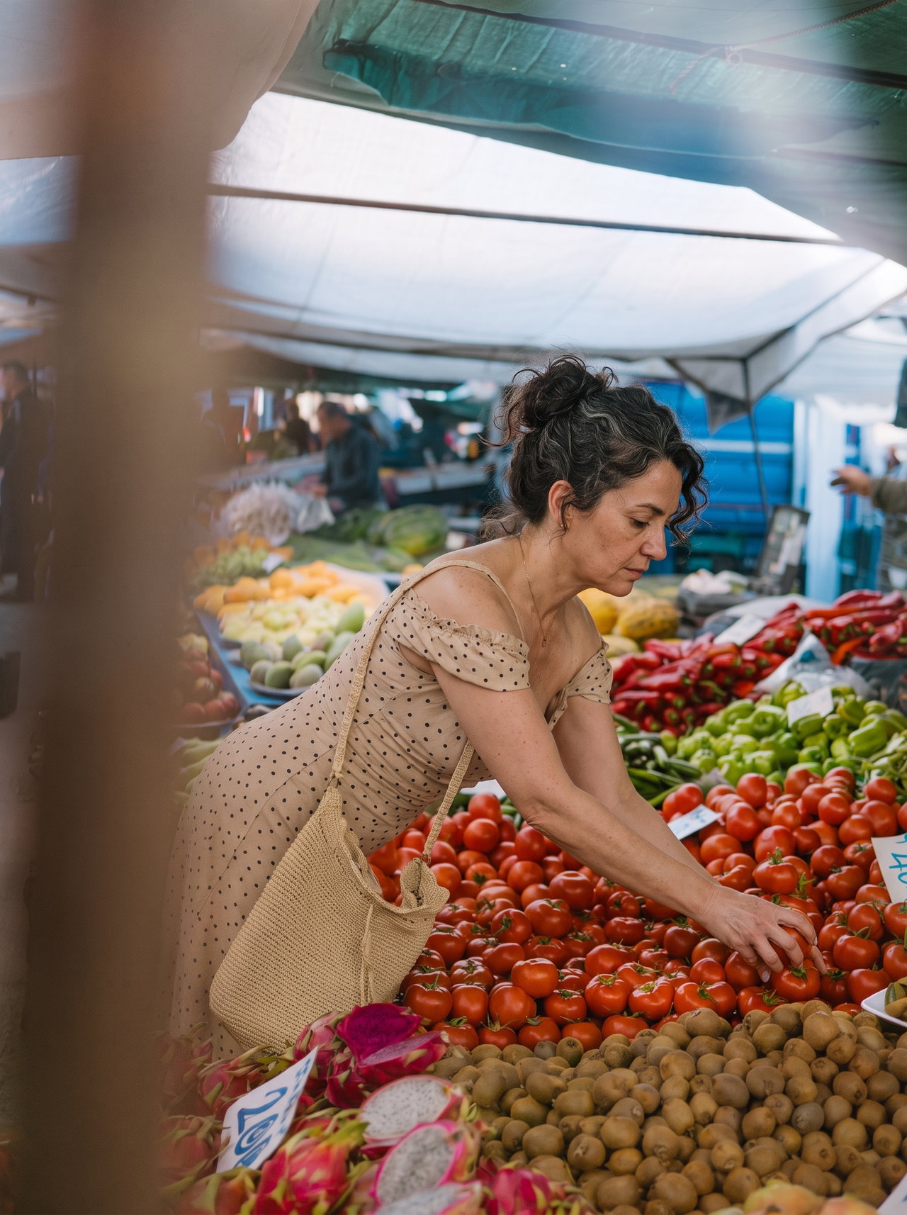 Woman Selecting Fresh Tomatoes at Market Stall