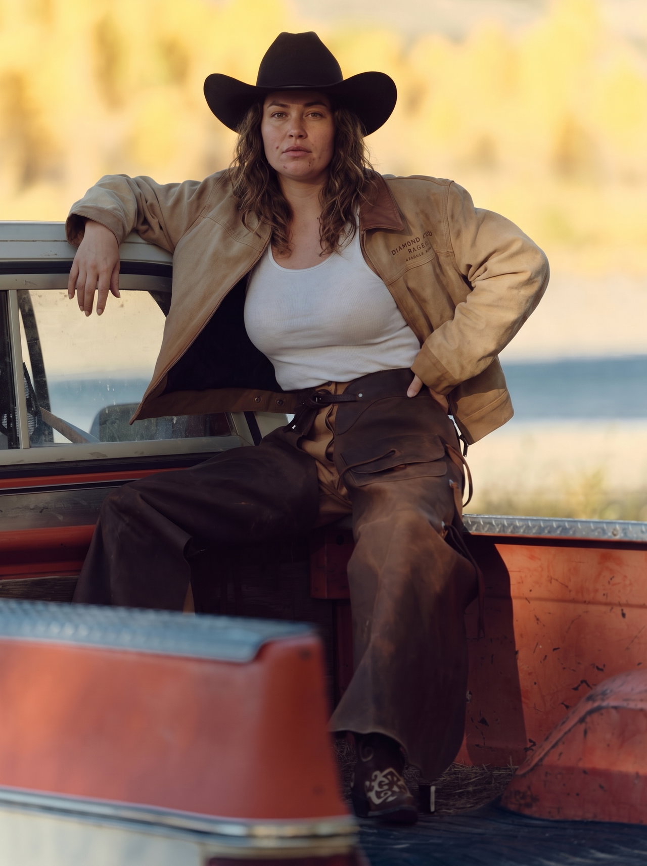 Woman in Cowboy Hat on Vintage Pickup Truck