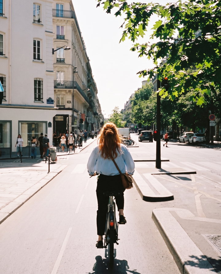 Cycling Woman in Paris Street