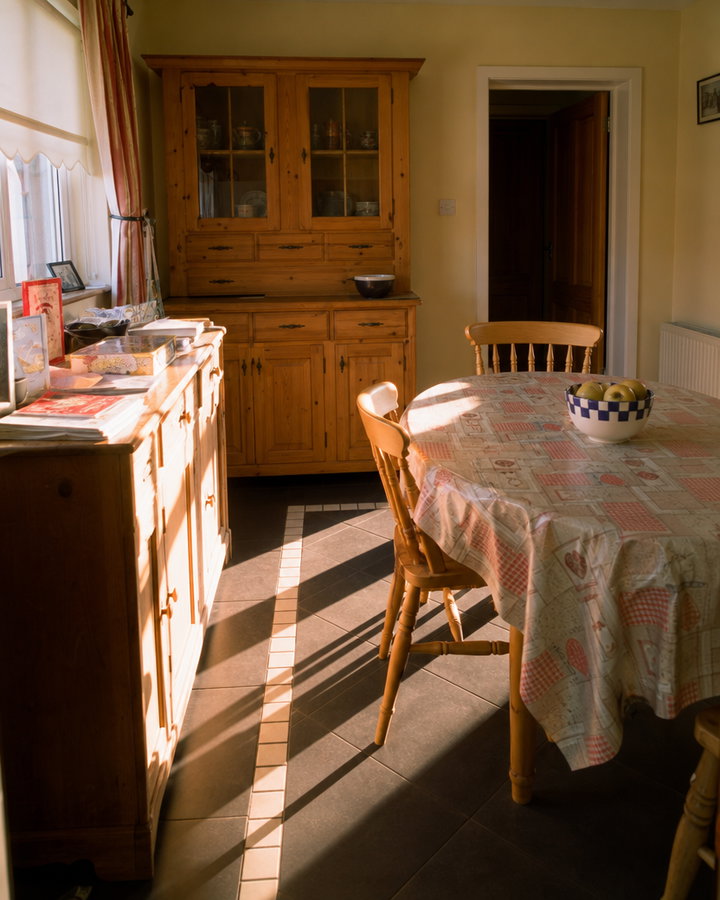 Country Kitchen with Round Table in Afternoon Sun