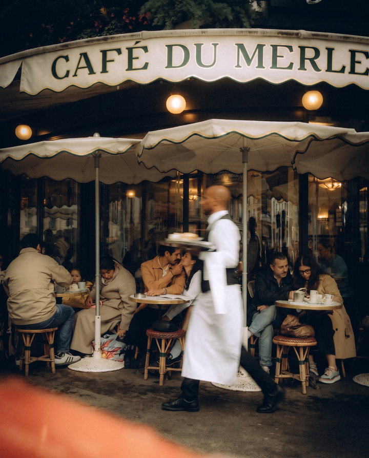 Waiter in Motion at Paris Cafe Terrace
