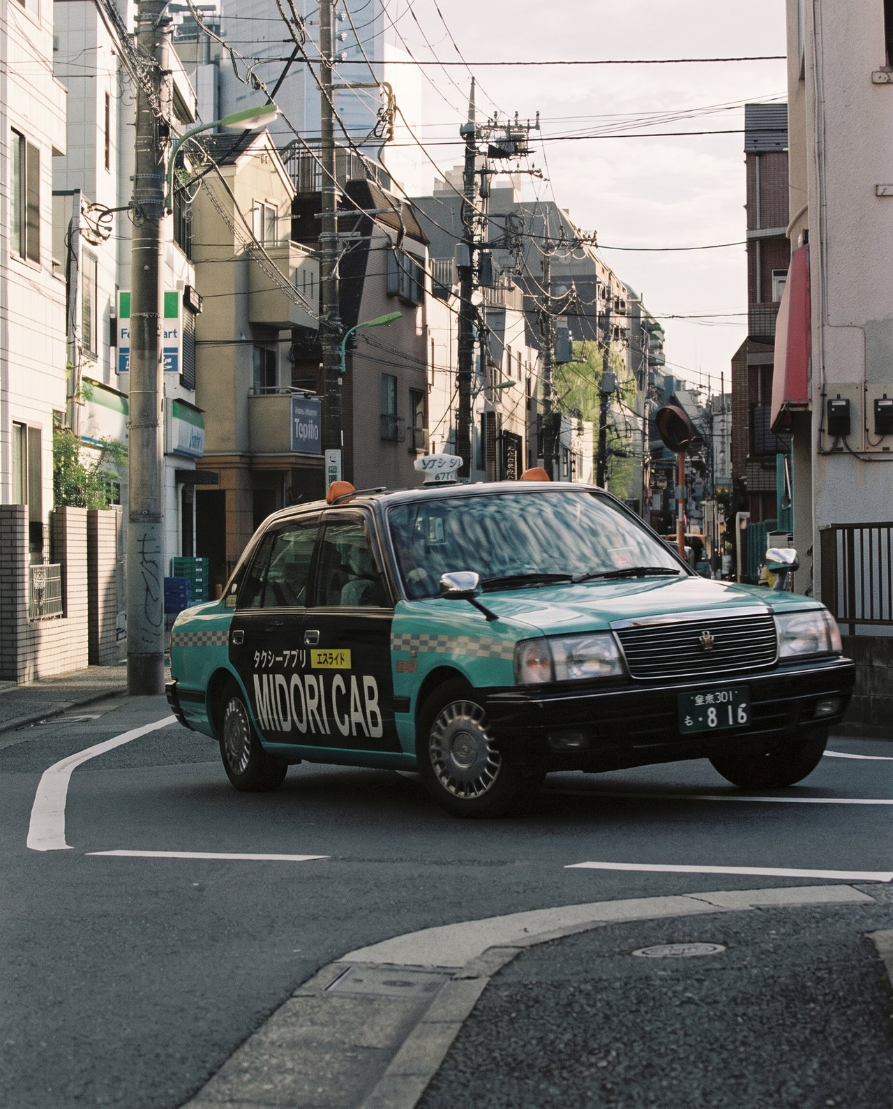 Tokyo Taxi Turning in Quiet Neighborhood