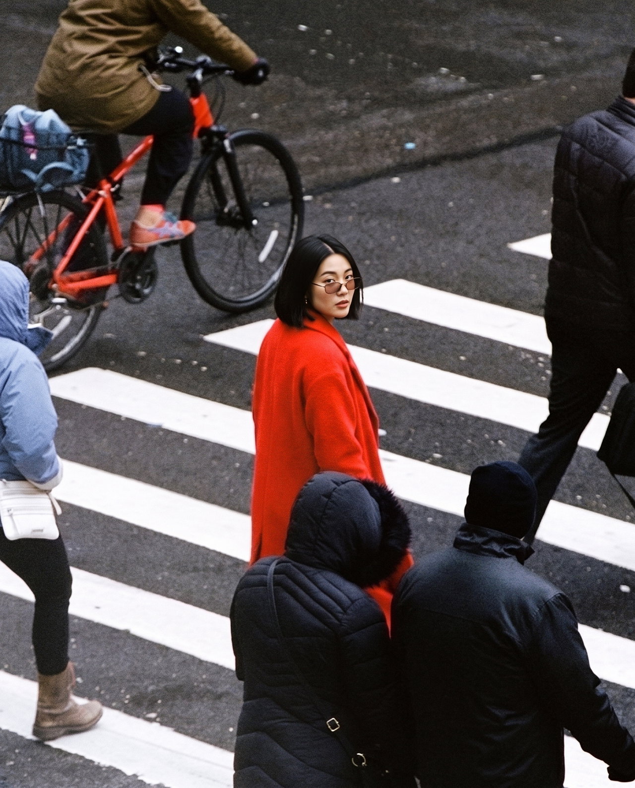 Woman in Red Coat on Pedestrian Crossing