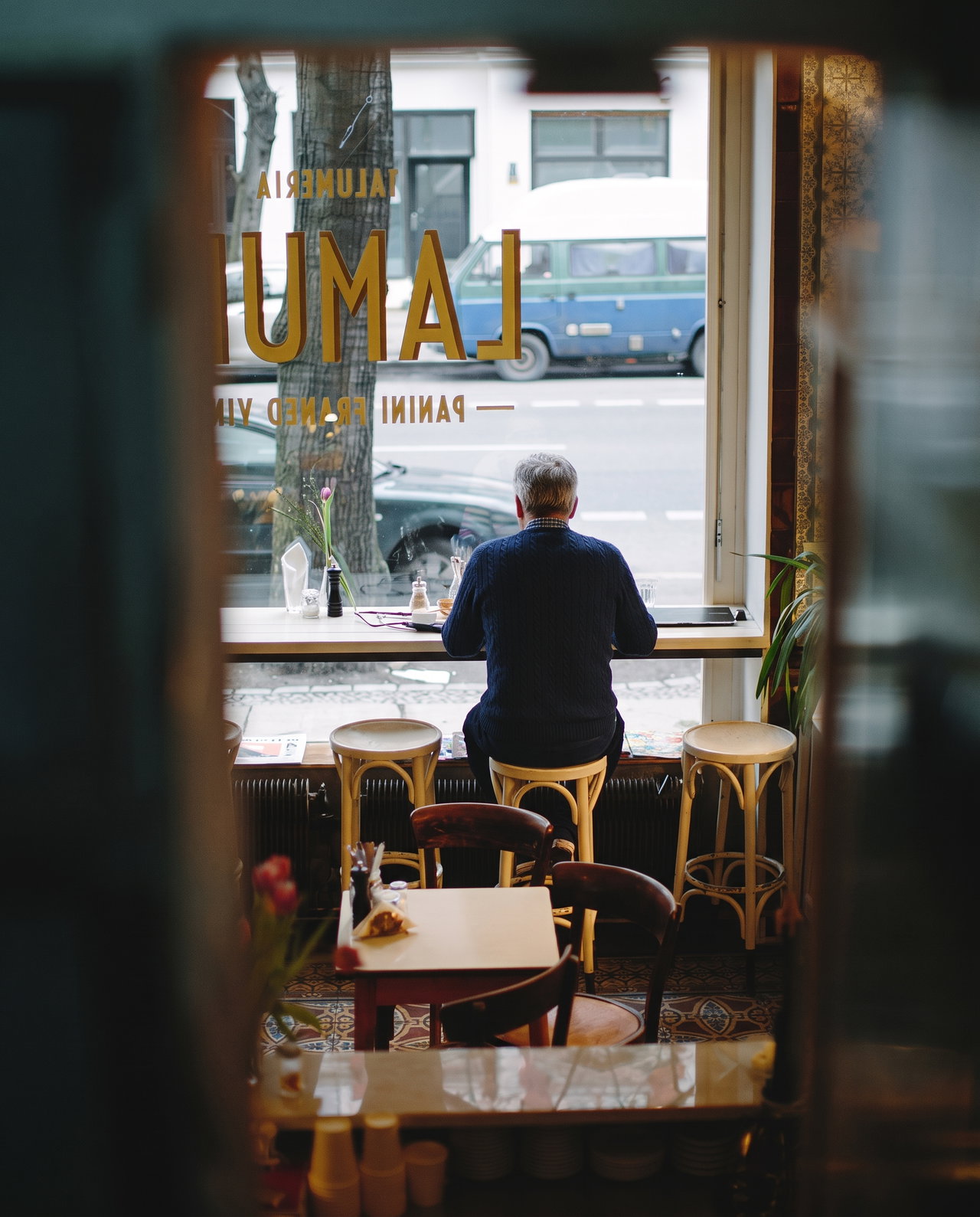 Man at Cafe Window Counter