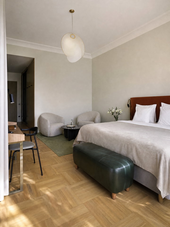 Bright Hotel Room with Parquet Floor