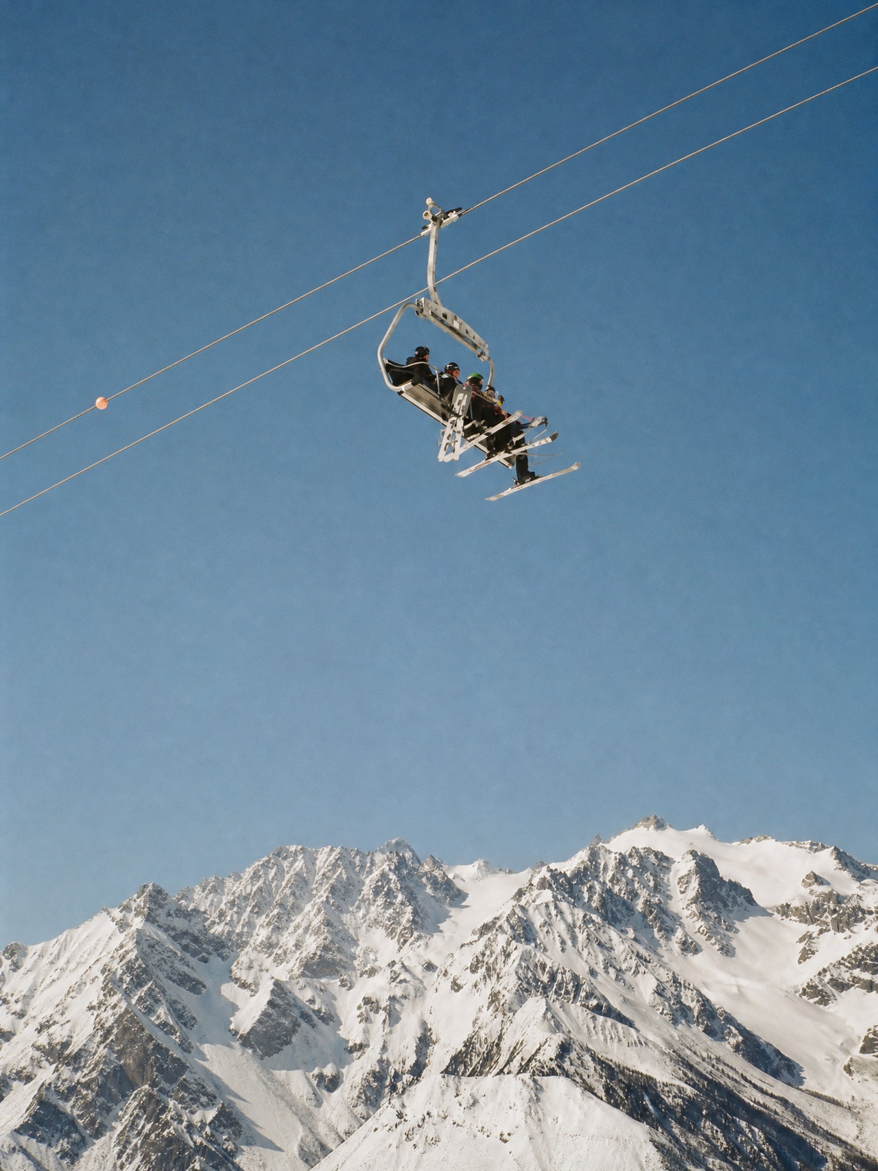 Chairlift Above Snowy Alps
