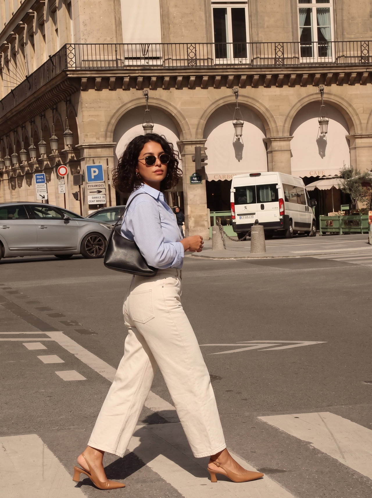 Walking Woman in Pale Blue Shirt and Wide-Leg Jeans