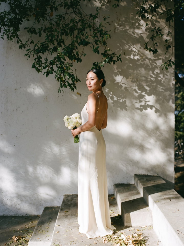 Bride on Garden Steps in Dappled Shade