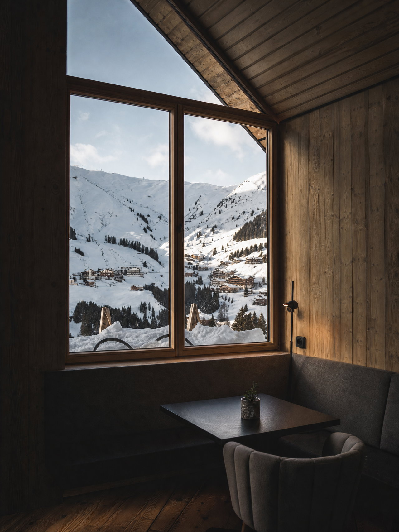Chalet Window View of Snowy Alpine Village