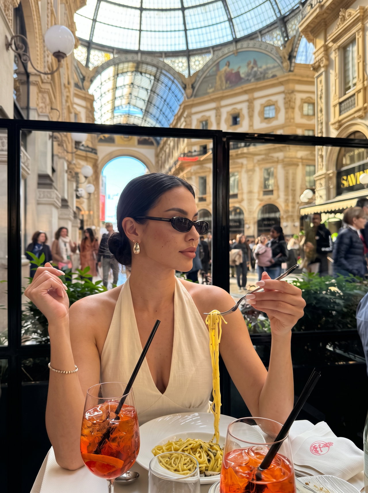 Elegant Woman Enjoying Spaghetti Lunch in Milan Galleria