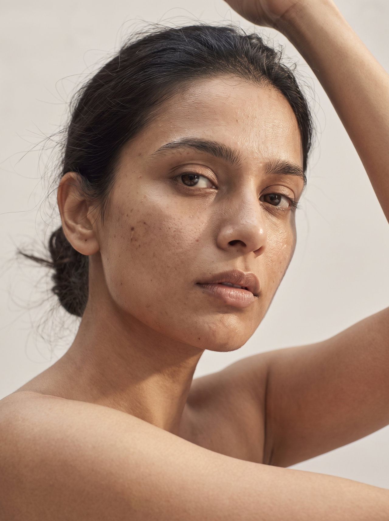 Bare-Skin Beauty Portrait with Raised Arms