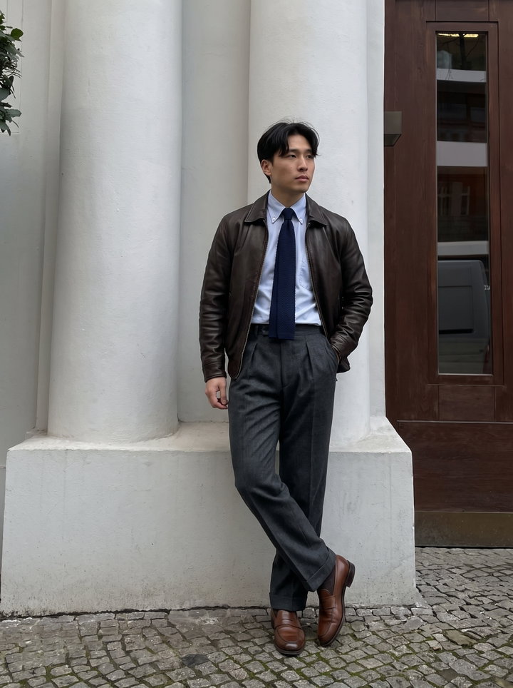 Stylish Man in Brown Leather Jacket and Charcoal Trousers