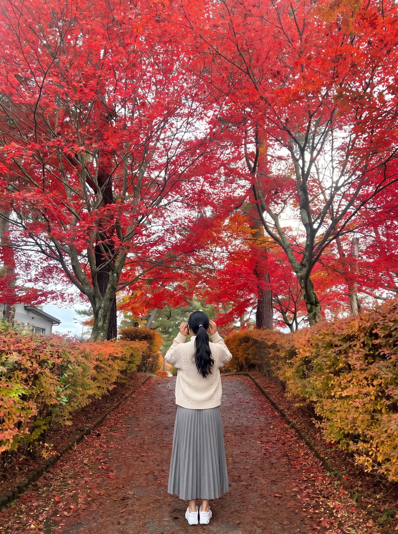 Woman in Pleated Skirt Among Red Maple Trees