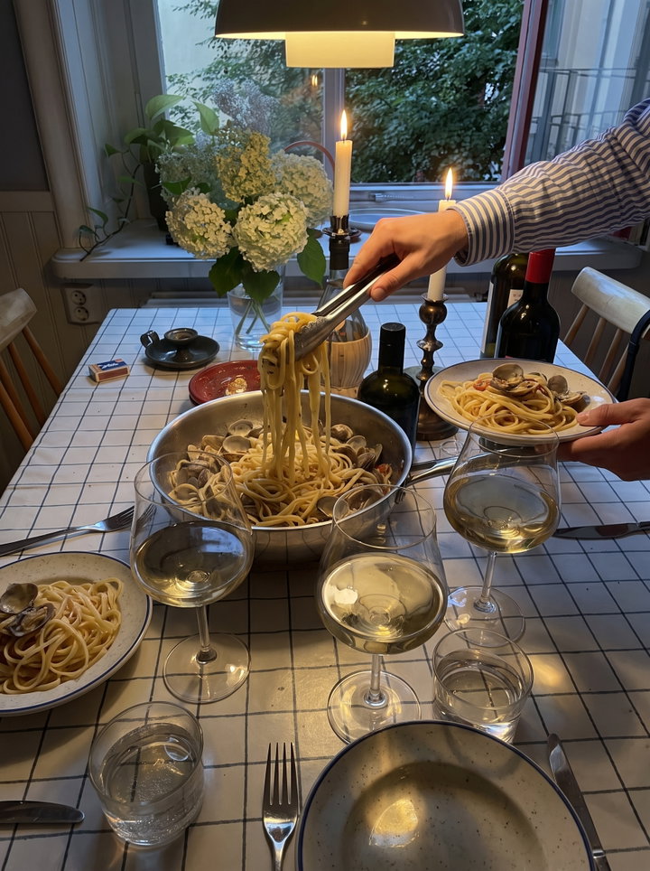 Serving Spaghetti with Clams at Dinner Party