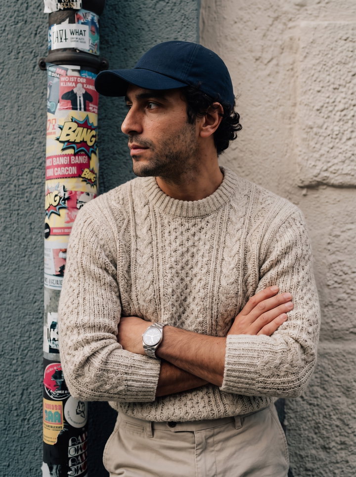 Man in Chunky Knit Sweater and Baseball Cap