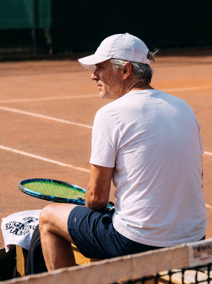 Resting Tennis Player on Clay Court
