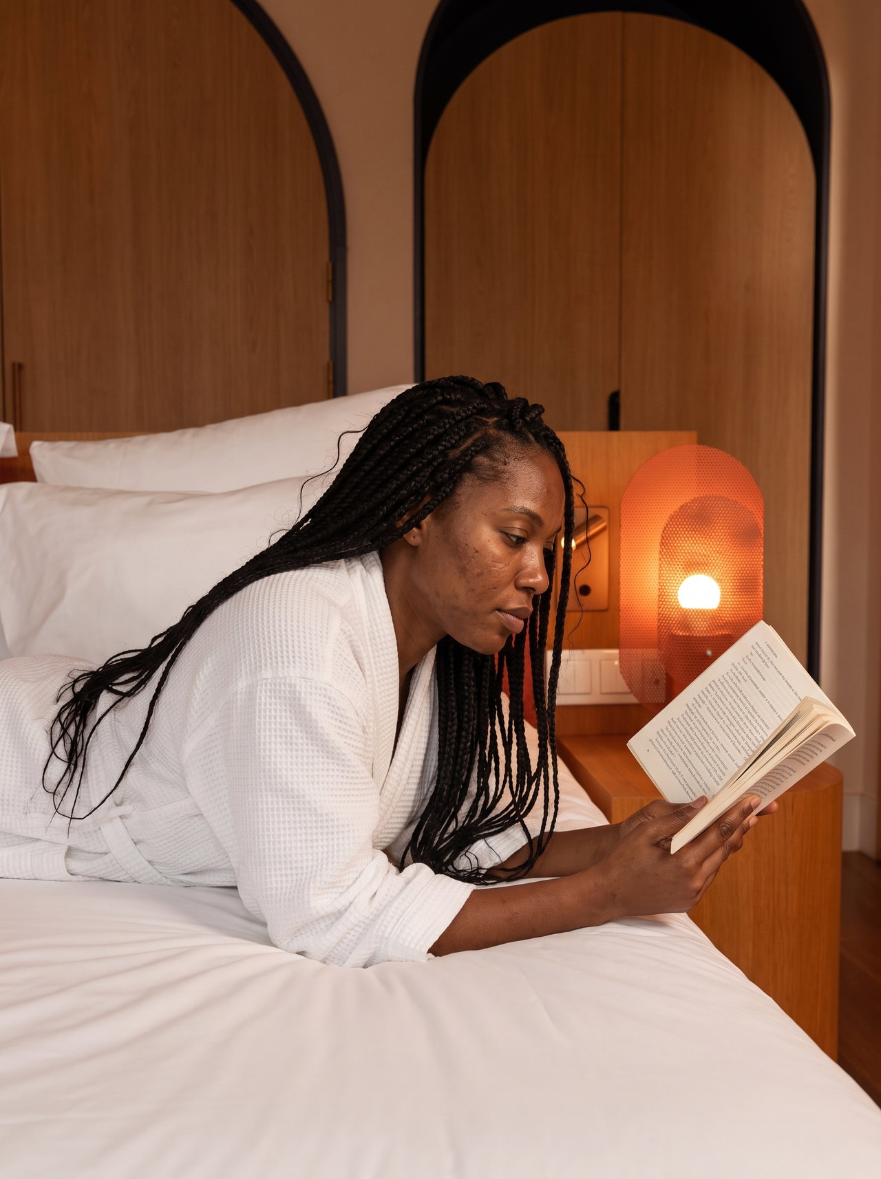 Woman Reading in Bed by Lamplight