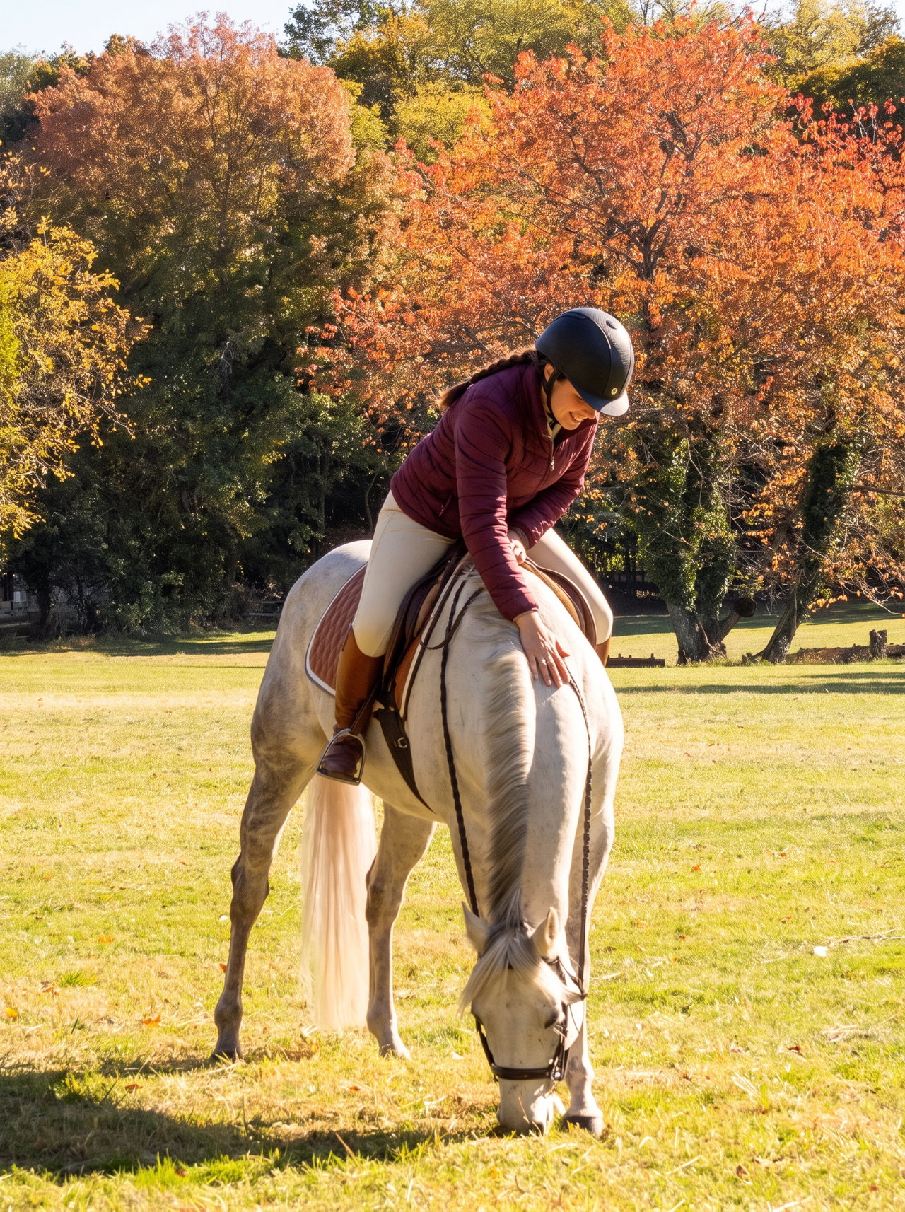 Rider Patting Grey Horse in Autumn Park