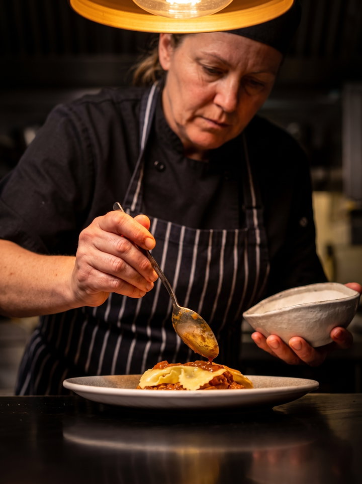 Chef Plating Ravioli in Restaurant Kitchen