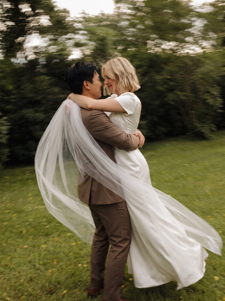 Newlyweds Embracing in Motion Blur