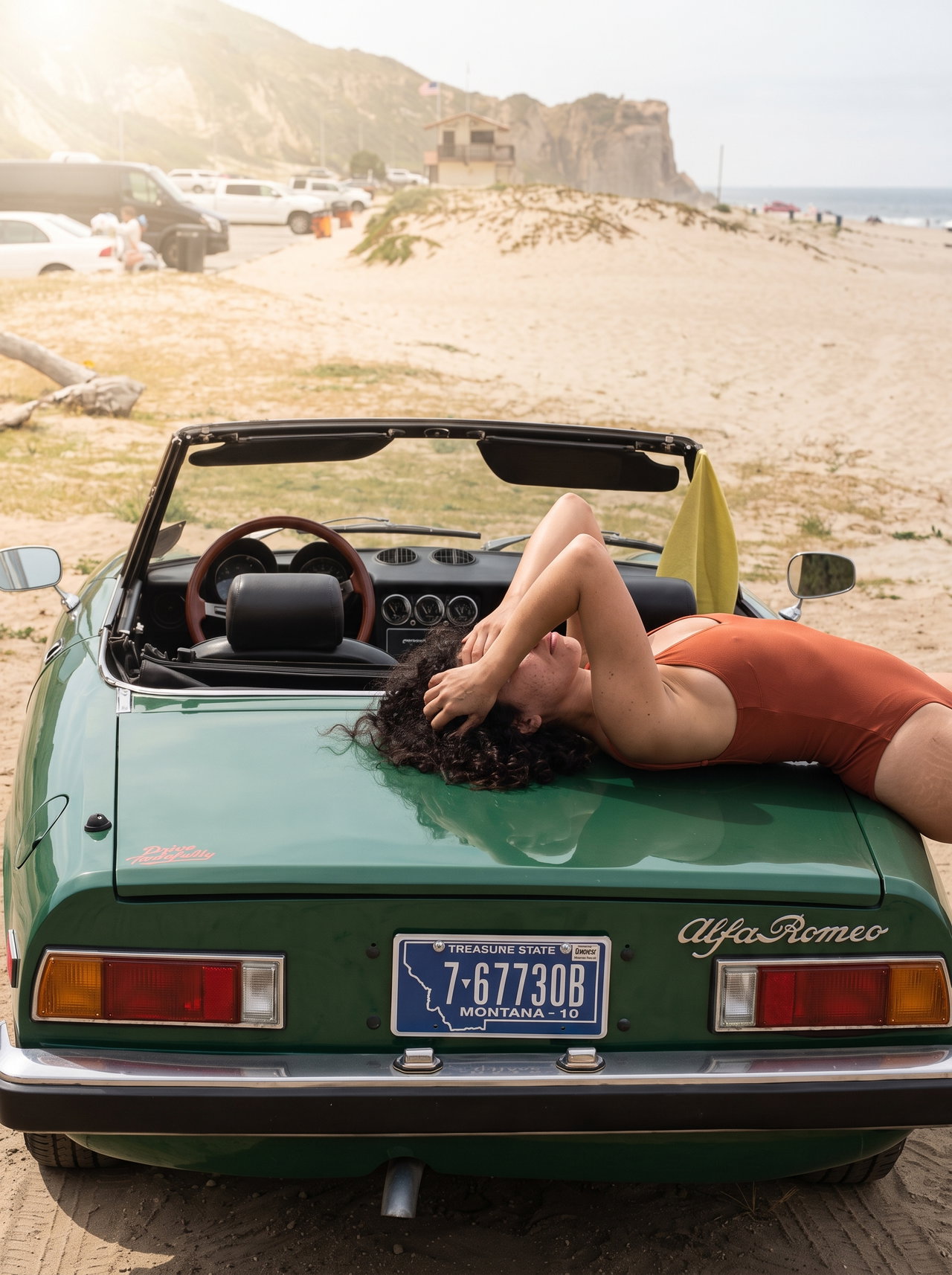 Sunbathing on Vintage Alfa Romeo at the Beach